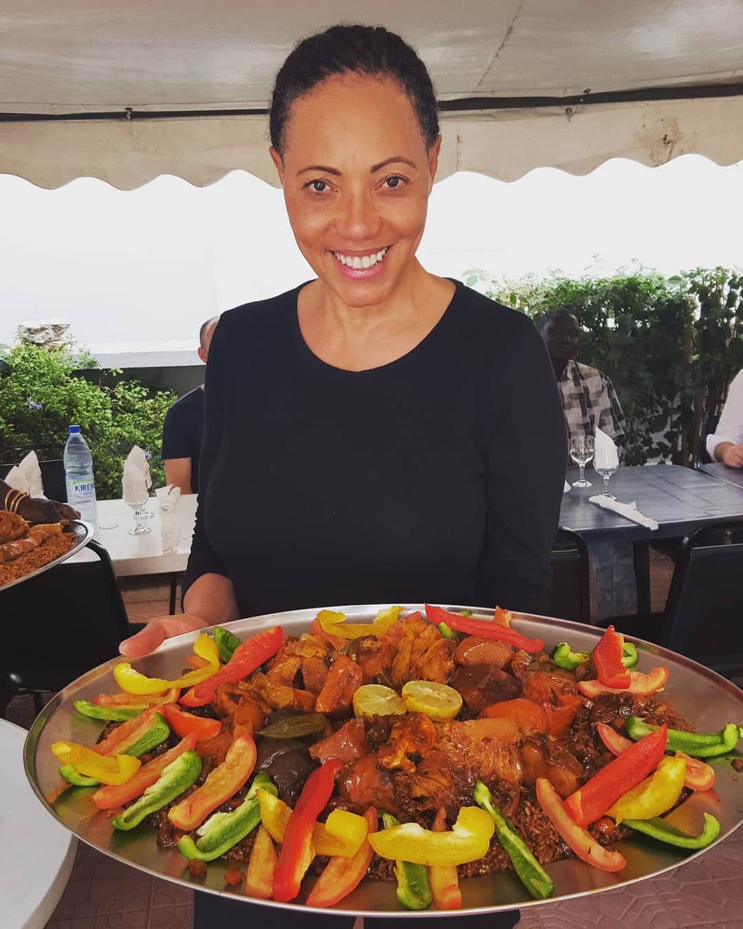 Chef Nina Curtis serving up a plate of fresh vegetables